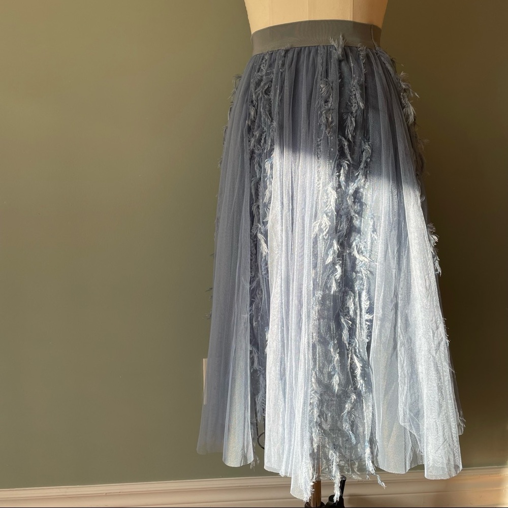 Light blue mesh skirt with fringes